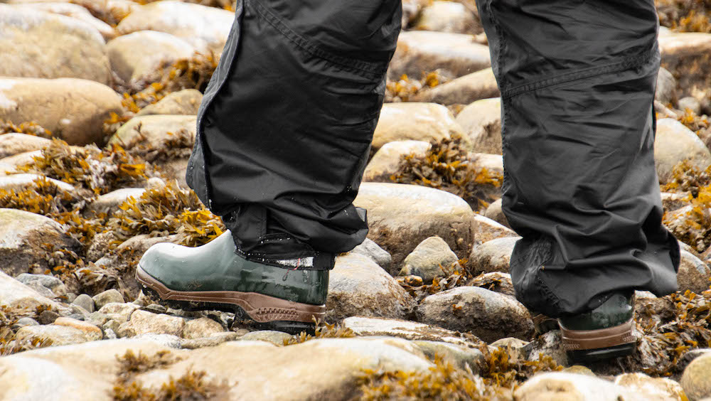 Rubber boots in use on a stony surface