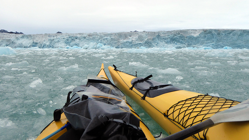Kayaking in front of a glacier