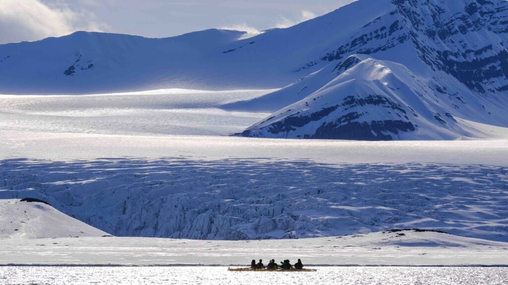 Kayak against a glacier backdrop