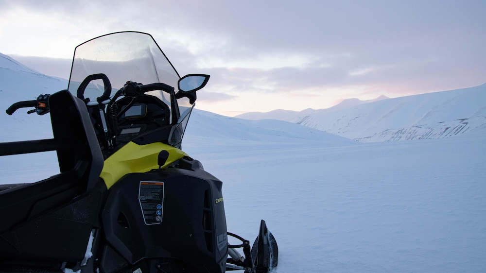 Snowmobile in the snowy landscape of Svalbard