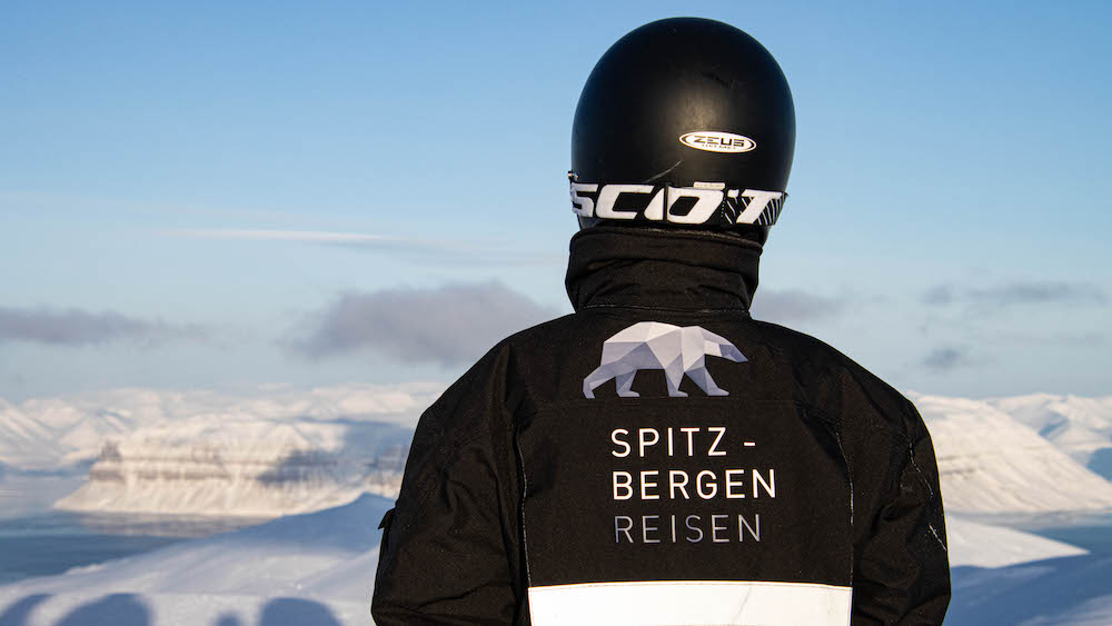 Snowmobile Suit with Helmet from Spitzbergen Reisen from behind