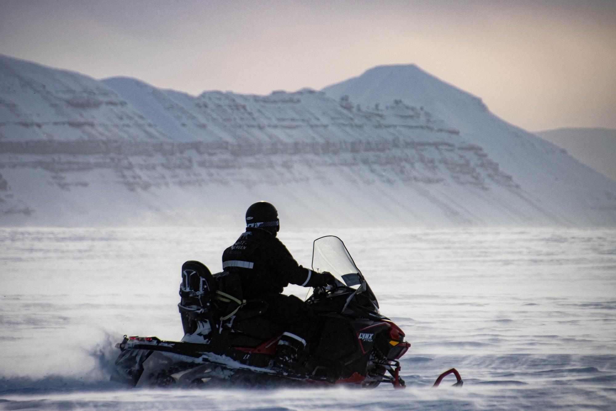 with the snowmobile on a winter expedition