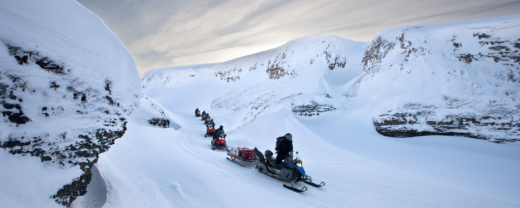 Driving snowmobile on Svalbard